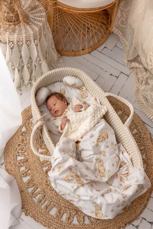 Babi in a handmade crochet Moses basket