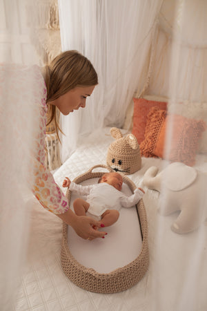 Crochet changing basket with a baby and mum