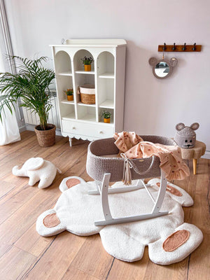 Grey-beige handmade crochet moses basket from The Baby Den in a white wooden stand